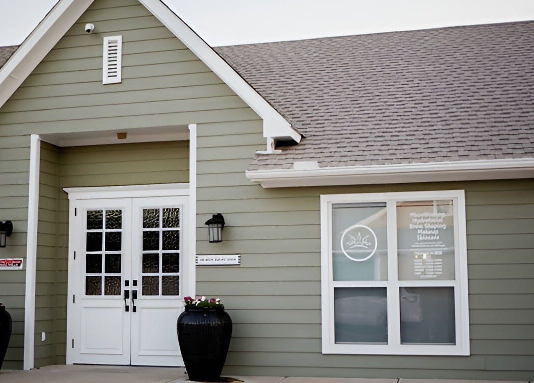 Elegant entrance of The Brow Shaping Queen in Frisco, Texas, US, showcasing modern exterior design.