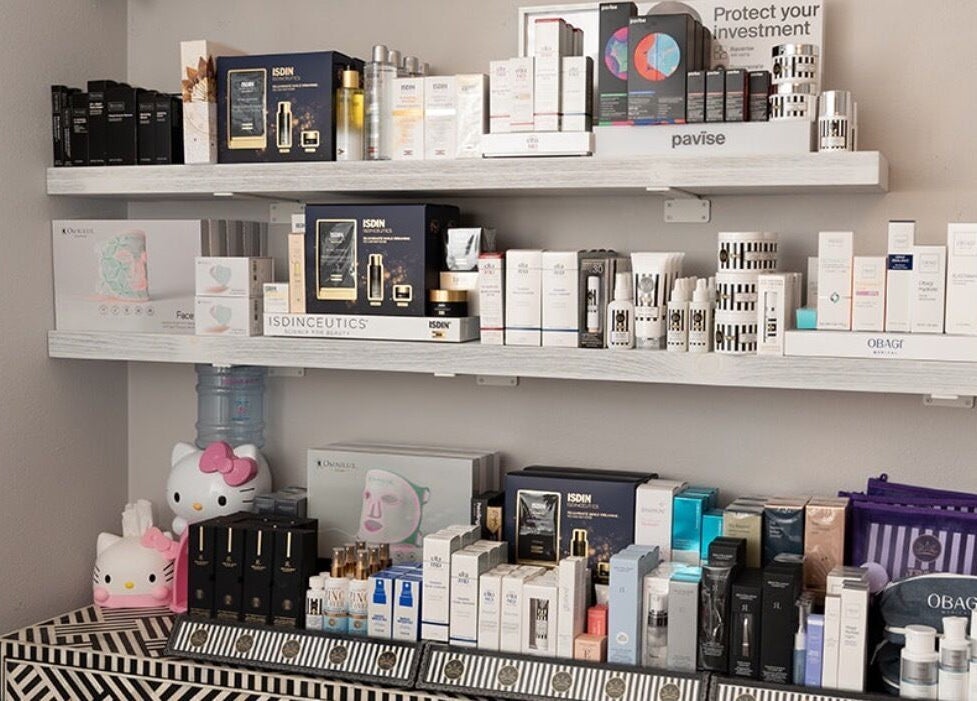 Shelf of premium beauty products at The Brow Shaping Queen in Frisco, Texas, US.