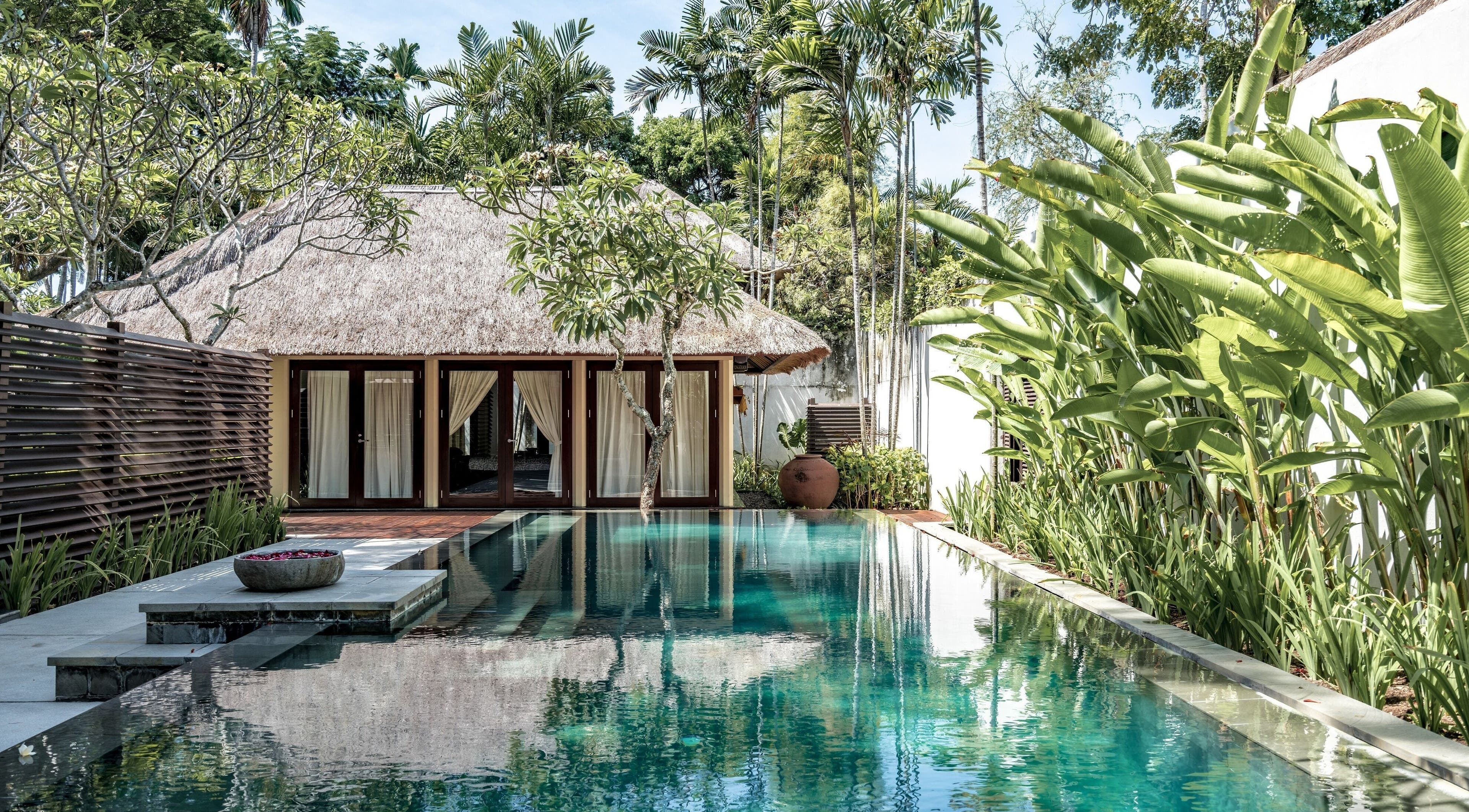 Serene poolside view at Kayumanis Spa Nusa Dua, Bali. Tranquil retreat in lush greenery, Bali, Bali, ID.