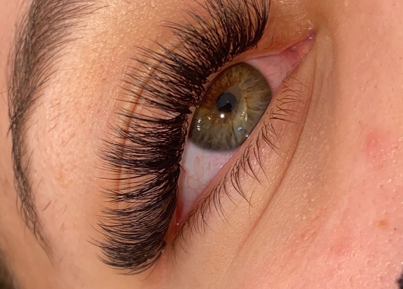 Close-up of professionally applied eyelash extensions at AW Beauty, Pembroke, Wales, GB.