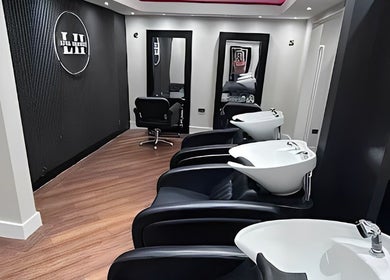 Modern wash stations and mirrors at Lysa Harvey Hair and Beauty in Bebington, England, GB.