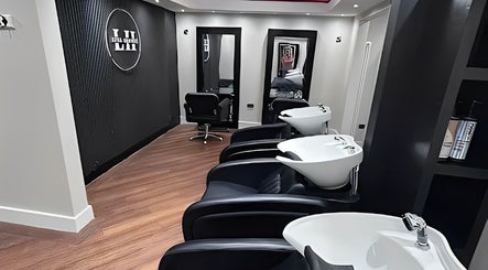 Modern wash stations and mirrors at Lysa Harvey Hair and Beauty in Bebington, England, GB.