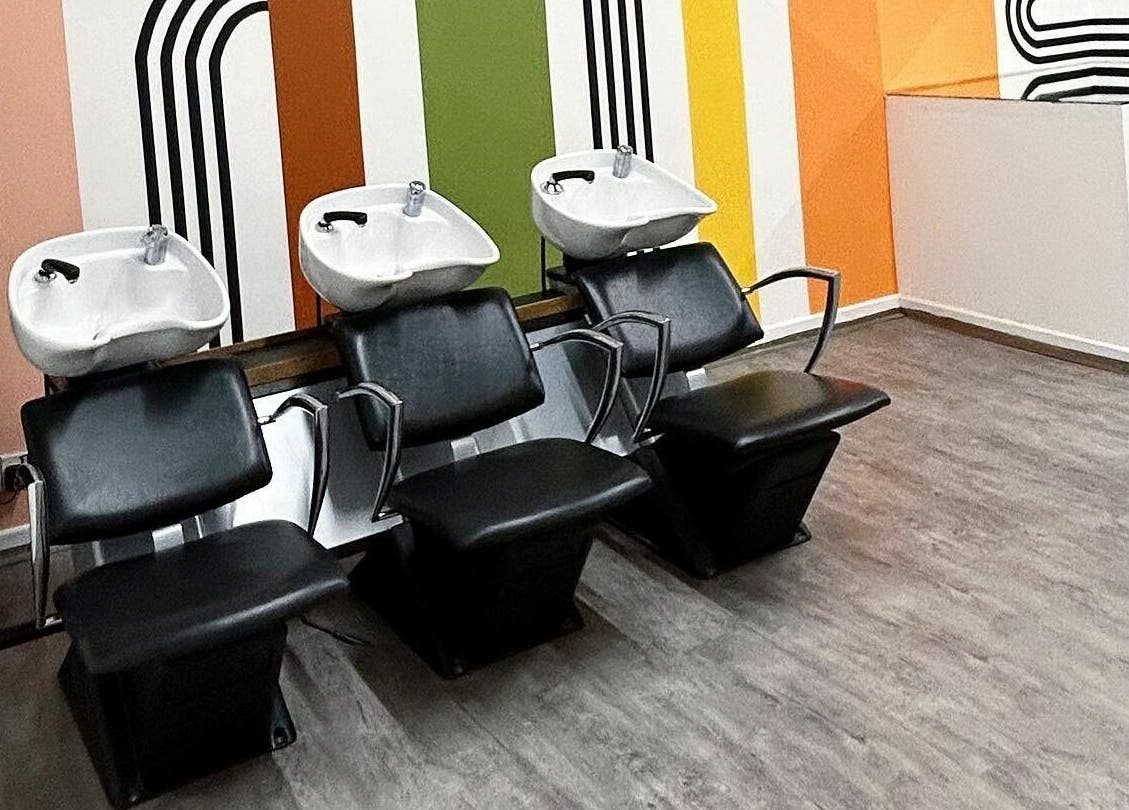Sleek washing station at That Nail Studio in Handforth, England, GB, featuring modern decor and colorful walls.