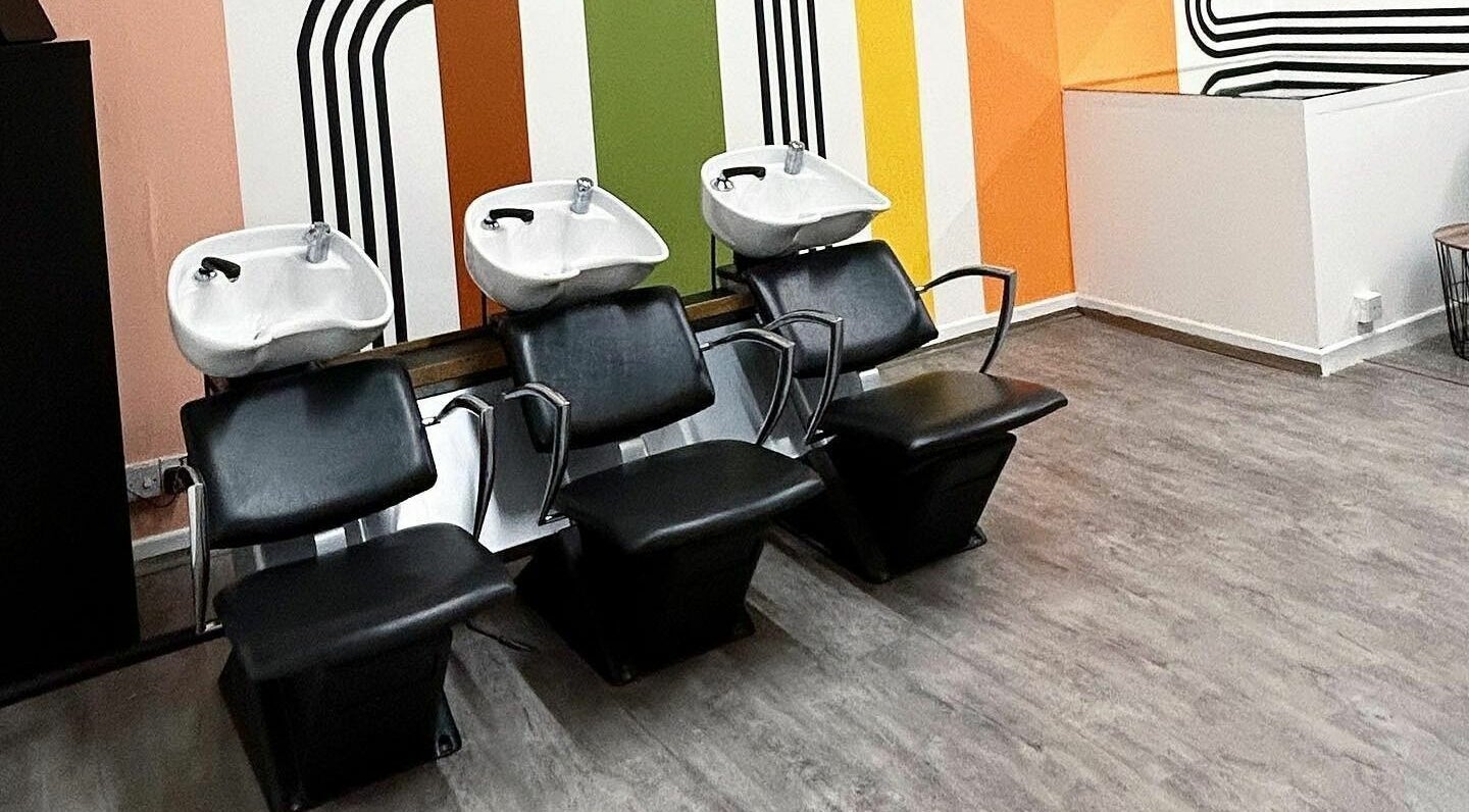 Sleek washing station at That Nail Studio in Handforth, England, GB, featuring modern decor and colorful walls.
