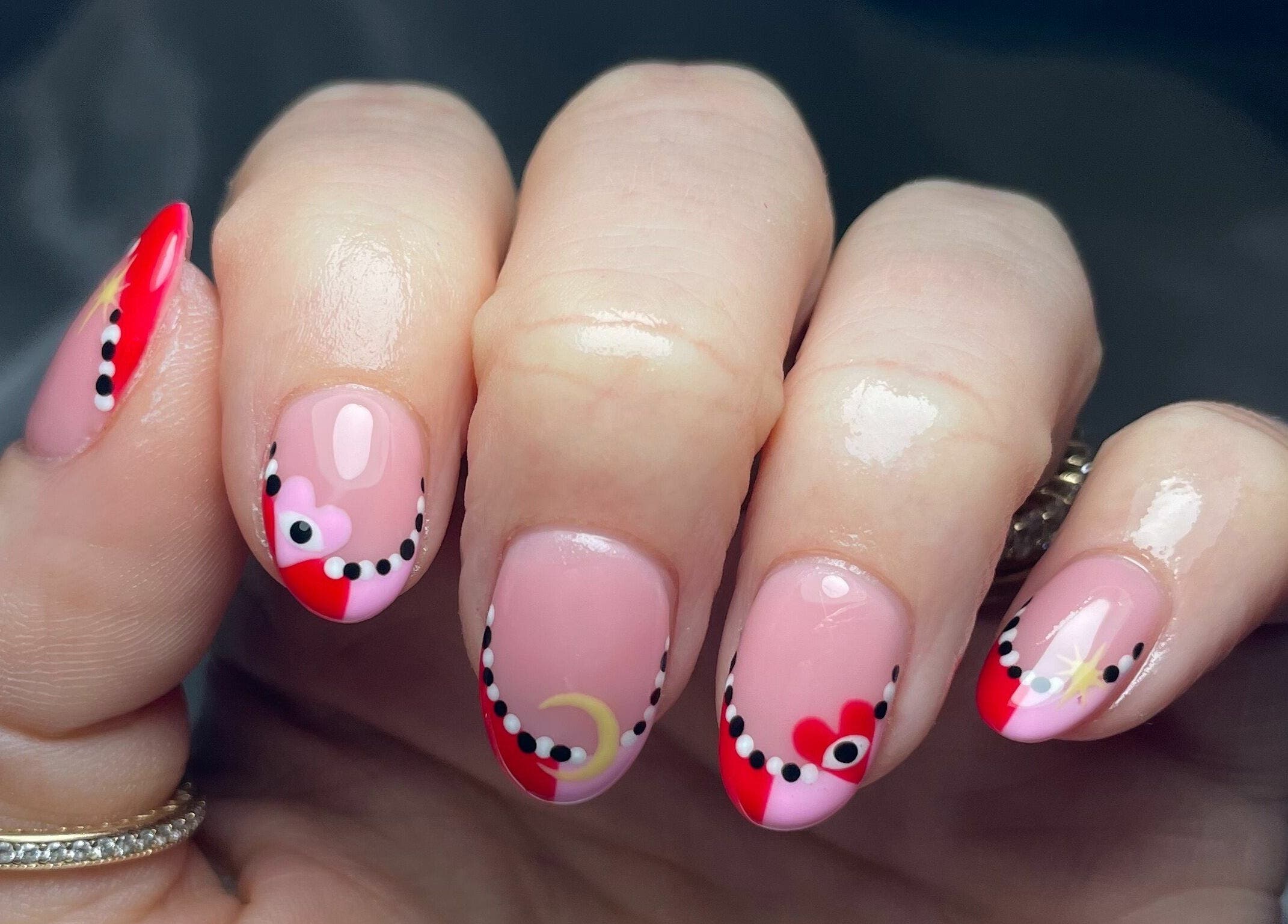 Elegant nail art with red and pink designs at That Nail Studio, Handforth, England, GB.