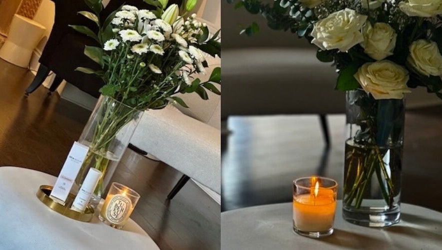 Elegant floral display and candle at Dr Heather Muir Aesthetics & Skin, Uddingston, Scotland, GB.