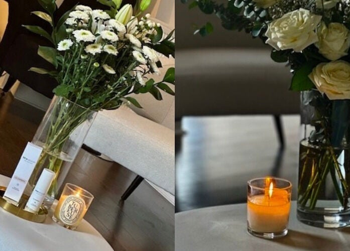 Elegant floral display and candle at Dr Heather Muir Aesthetics & Skin, Uddingston, Scotland, GB.