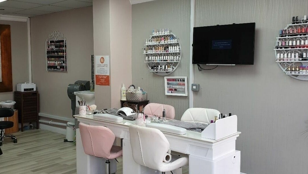 Elegant nail salon at Broadway Beauty, Southend-on-Sea, England, GB featuring plush chairs and nail polish displays.