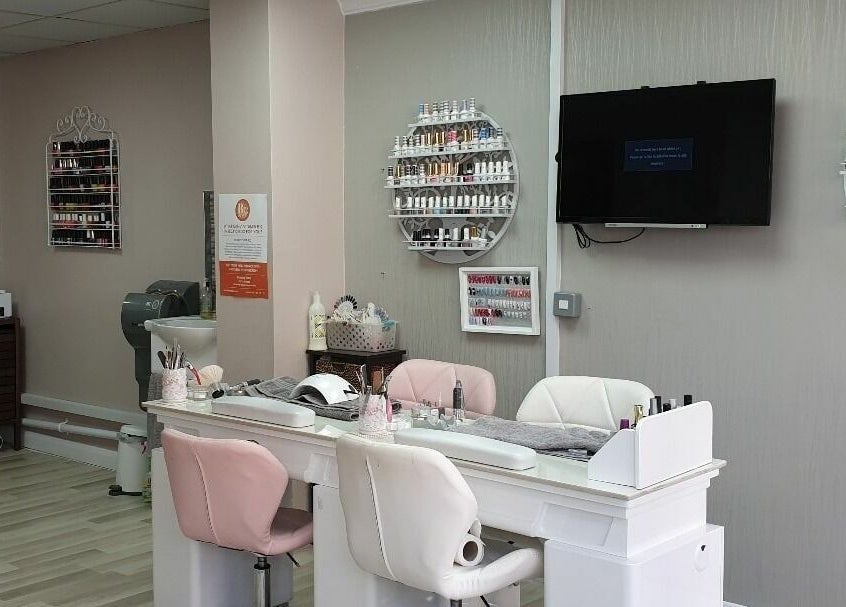 Elegant nail salon at Broadway Beauty, Southend-on-Sea, England, GB featuring plush chairs and nail polish displays.