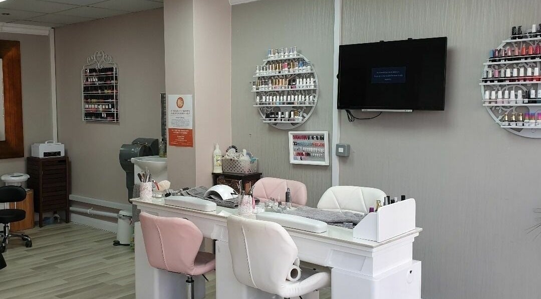 Elegant nail salon at Broadway Beauty, Southend-on-Sea, England, GB featuring plush chairs and nail polish displays.