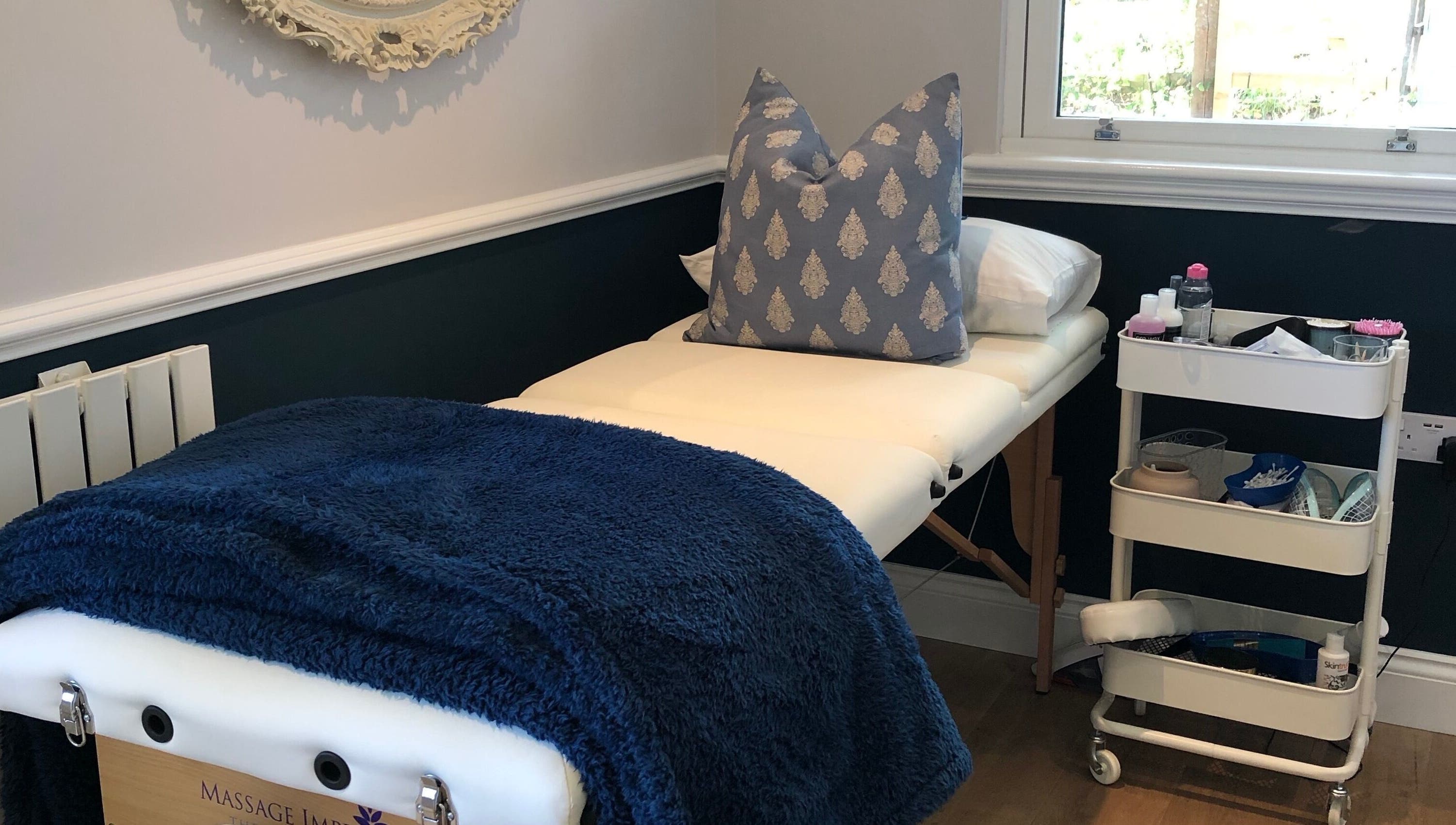 Massage table with blue blanket at Fieldwaylife Beauty, Berkhamsted, England, GB.