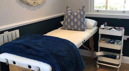 Massage table with blue blanket at Fieldwaylife Beauty, Berkhamsted, England, GB.