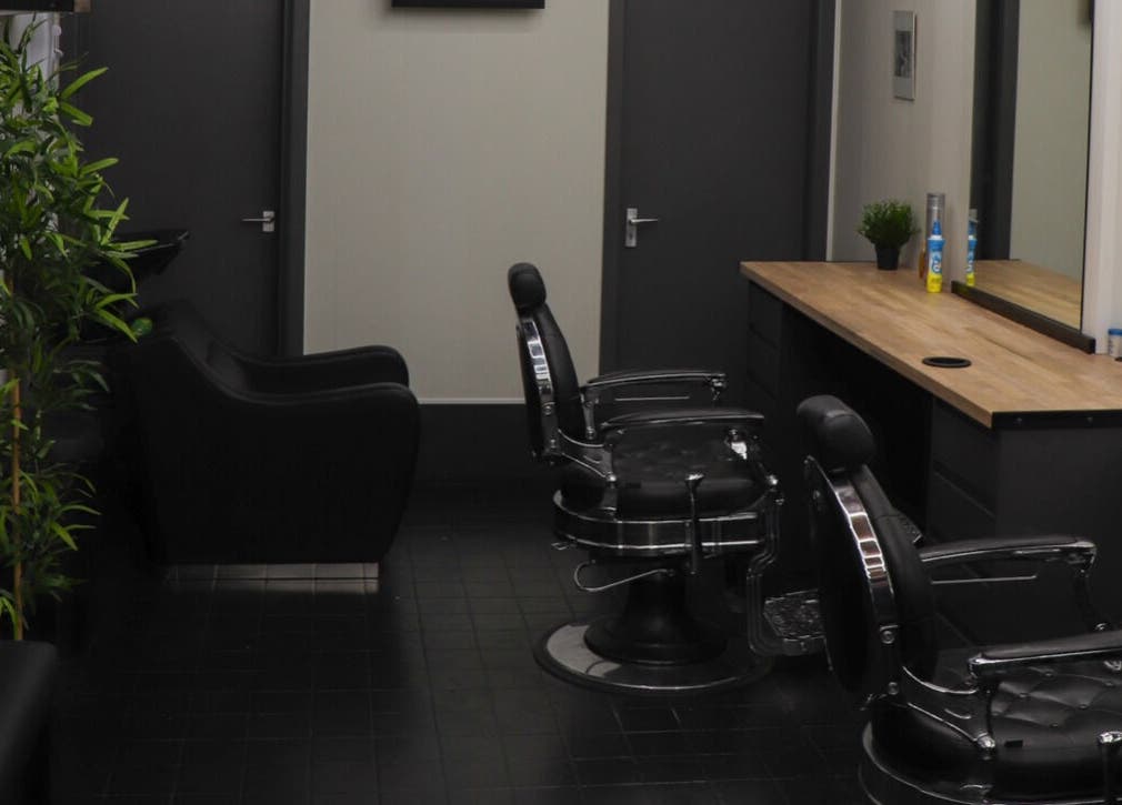 Modern barber chairs and sleek decor at Sauchiehall Barbers, Glasgow, Scotland, GB.