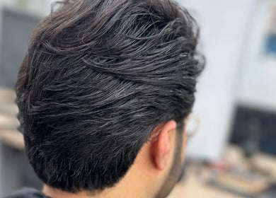 Freshly styled layered haircut at Sauchiehall Barbers in Glasgow, Scotland, GB.