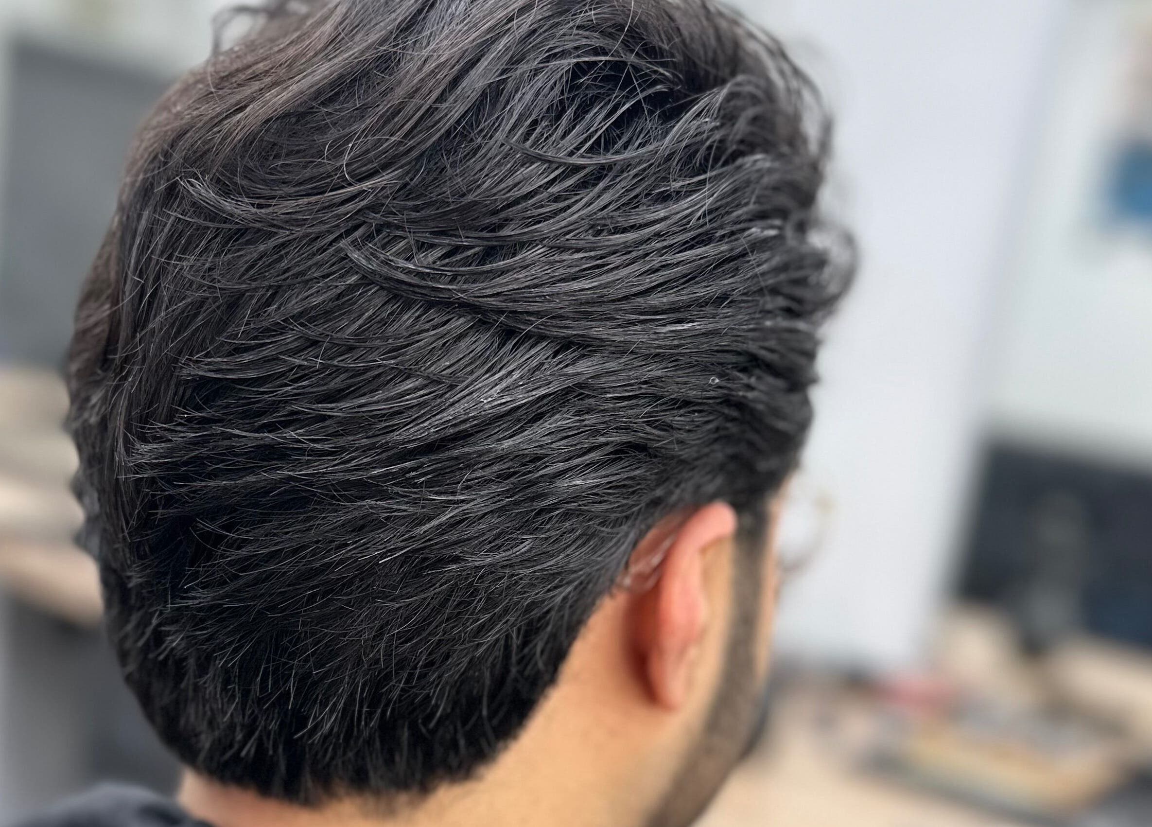 Fresh haircut detail at Sauchiehall Barbers in Glasgow, Scotland, GB showcasing expertly styled hair.