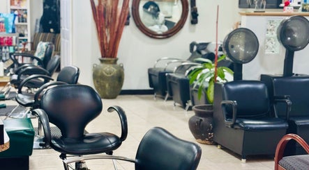 Interior of Arelis Beauty Salon featuring chic black seating in Orlando, Florida, US.