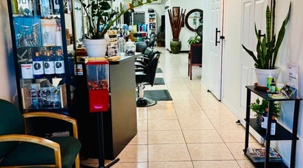 Spacious interior of Arelis Beauty Salon in Orlando, Florida, US showcasing sleek chairs and vibrant plants.