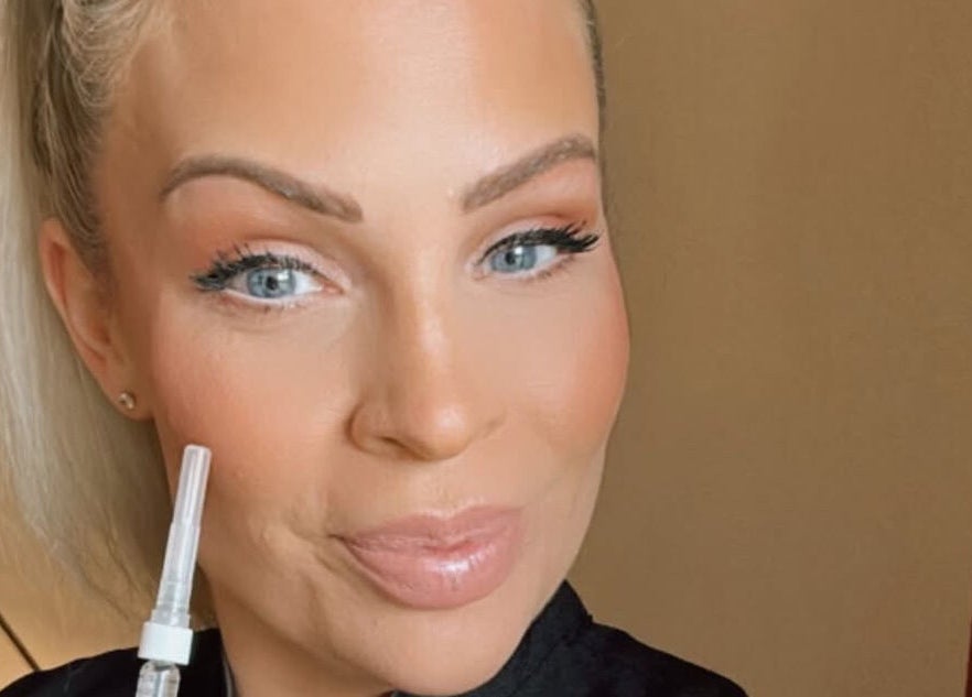 A beauty specialist at Laura at Elite Beauty, Peterborough, England, GB, holding a beauty tool.