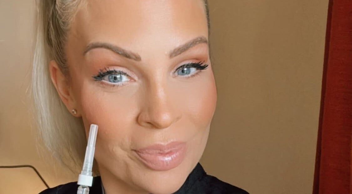 A beauty specialist at Laura at Elite Beauty, Peterborough, England, GB, holding a beauty tool.