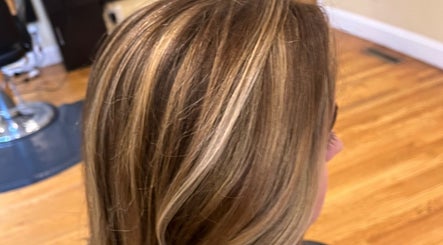Beautiful blonde highlights on hair at Salon Femia, Somerville, Massachusetts, US, showcasing expert styling.