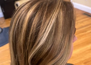 Highlighted hair styled to perfection at Salon Femia, Somerville, Massachusetts, US.