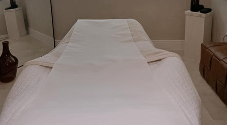 Relaxing treatment bed at The Glow Clinic, Cardiff Bay, GB, offering premium beauty and wellness services.