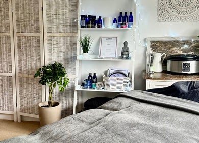 Serene therapy room at Gower Garden Therapies in Southgate, Wales, GB, with cozy massage bed.