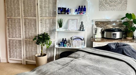 Serene therapy room at Gower Garden Therapies in Southgate, Wales, GB, with cozy massage bed.