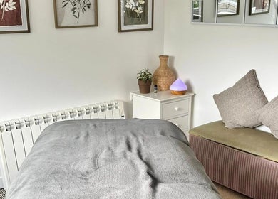Tranquil therapy room at Gower Garden Therapies, Southgate, Wales, GB with cozy decor and soft lighting.