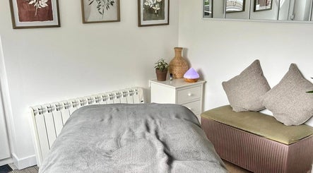Tranquil therapy room at Gower Garden Therapies, Southgate, Wales, GB with cozy decor and soft lighting.