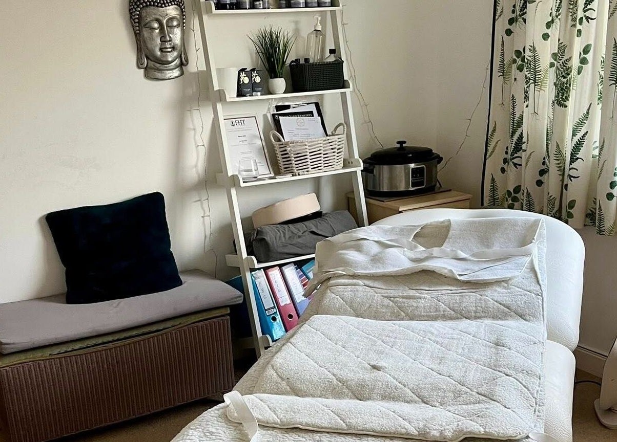 Tranquil therapy room at Gower Garden Therapies, Southgate, Wales, GB, featuring a massage bed and serene decor.