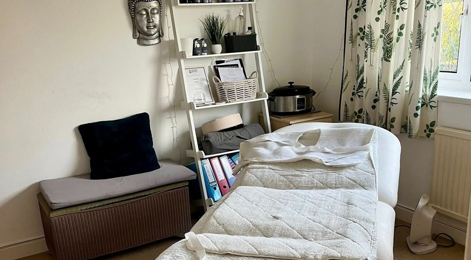 Tranquil therapy room at Gower Garden Therapies, Southgate, Wales, GB, featuring a massage bed and serene decor.