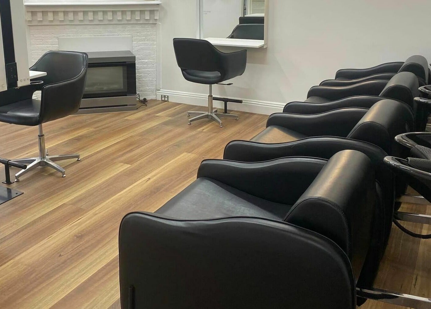 Modern wash stations and chairs at Salon Hype, Bendigo, VIC, AU showcasing stylish comfort.