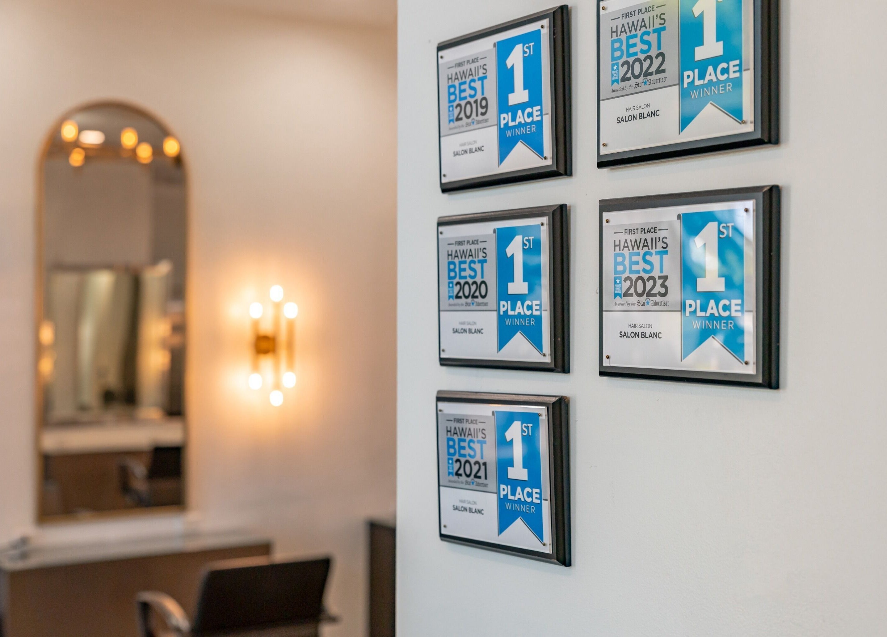 Award-winning plaques at Salon Blanc, the celebrities salon in Honolulu, Hawaii, US reflecting excellence and prestige.