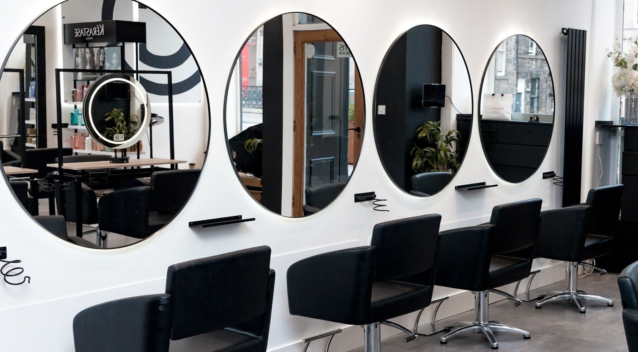 Modern salon mirrors and chairs at Cascal Hair Studio in Edinburgh, Scotland, GB.