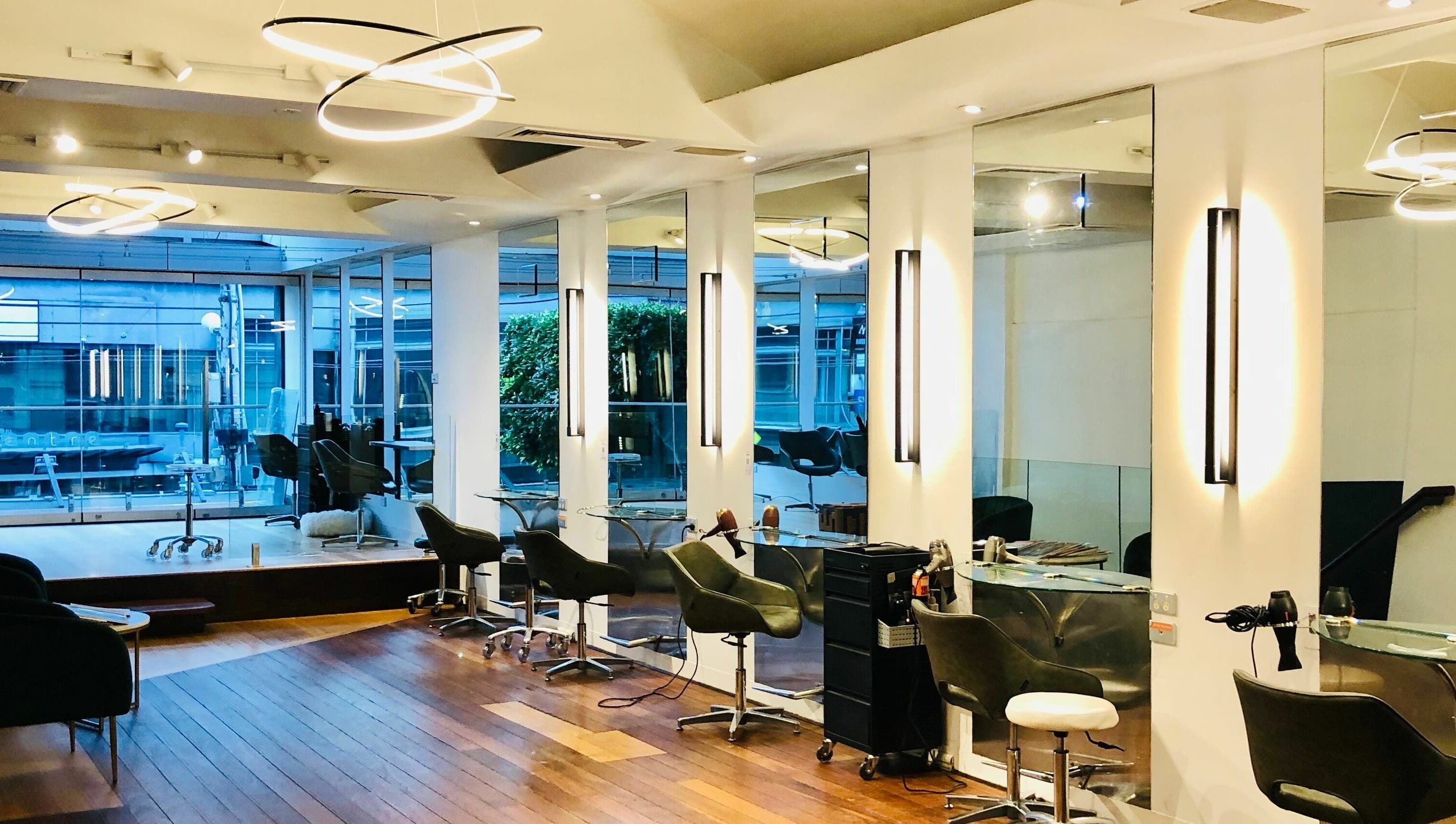 Sophisticated interior of Prodigal Hairdressing in Toorak, Victoria, AU with stylish seating and modern lighting.