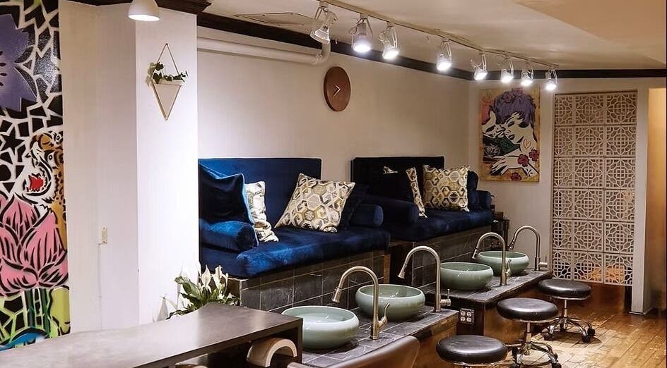 Elegantly designed pedicure area at VIBLiSSiMO Art of Beauty, New York, New York, US with plush seating and modern decor.