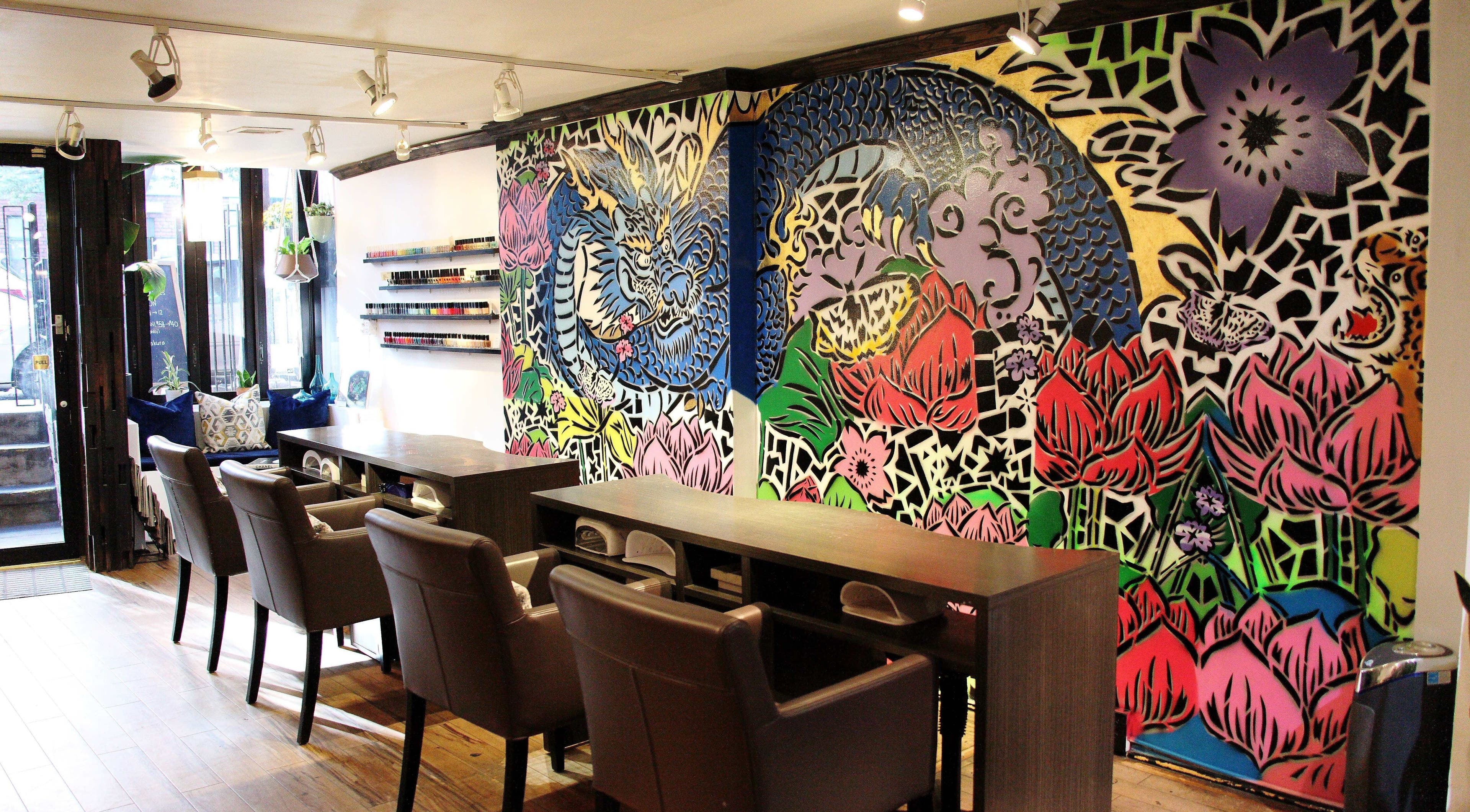 Colorful mural and manicure stations at VIBLiSSiMO Art of Beauty, New York, New York, US.