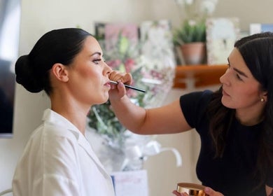 Makeup artist at Katie Wrynne Makeup & Beauty in County Galway, IE, applying lipstick.