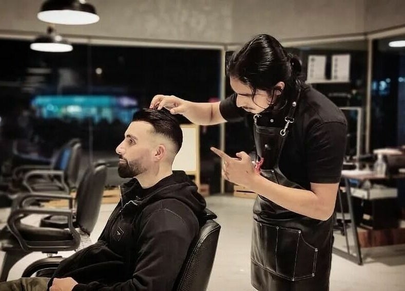 Professional barber styling hair at The Loft Prime Gent's Salon, Dubai, Dubai, AE.