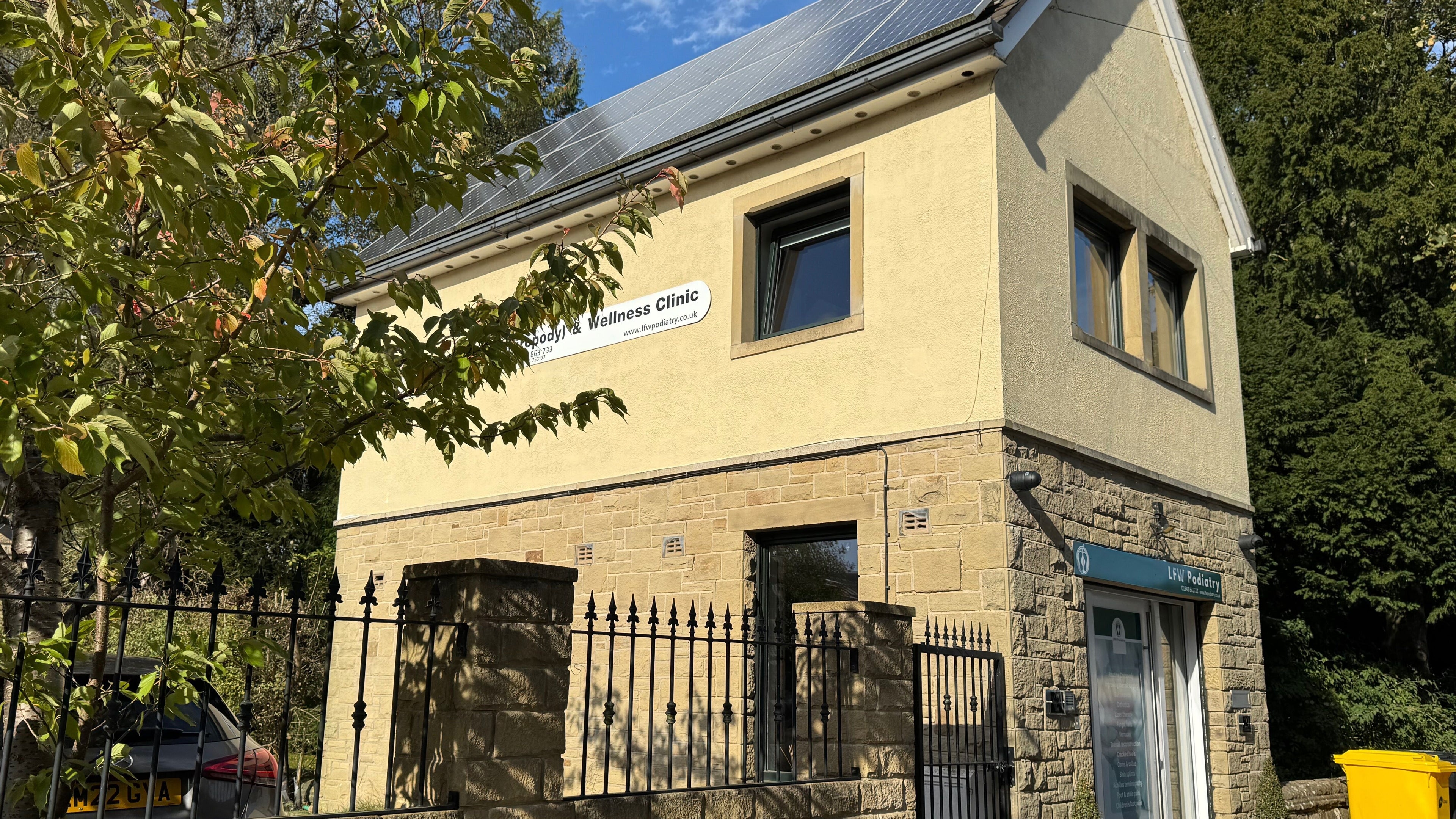 Front view of LFW Podiatry (Chiropody) Clinic - Ilkley surrounded by trees in Ilkley, GB.