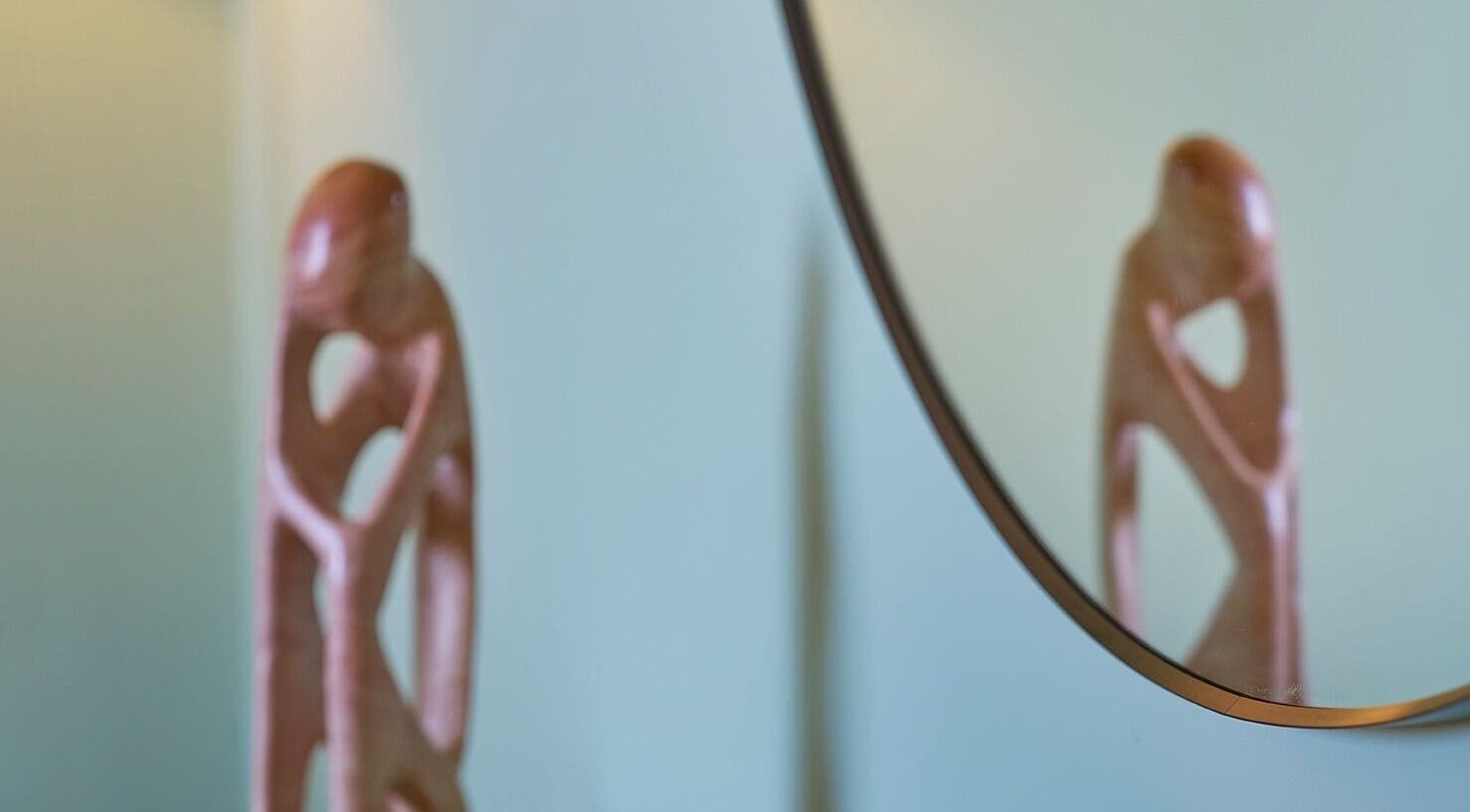 Stylish sculpture reflected in a mirror at Thrive Therapies, Bideford, England, GB.