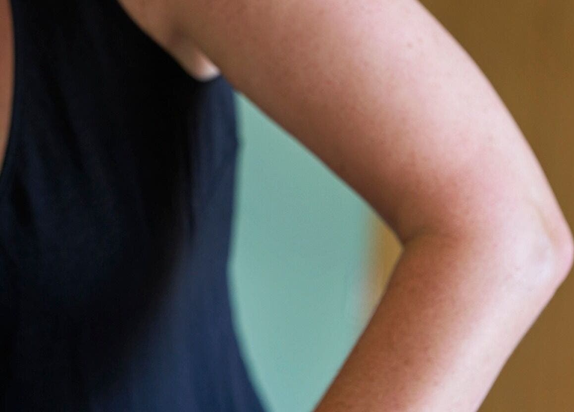 Side view of a relaxed arm in a serene setting at Thrive Therapies, Bideford, England, GB.