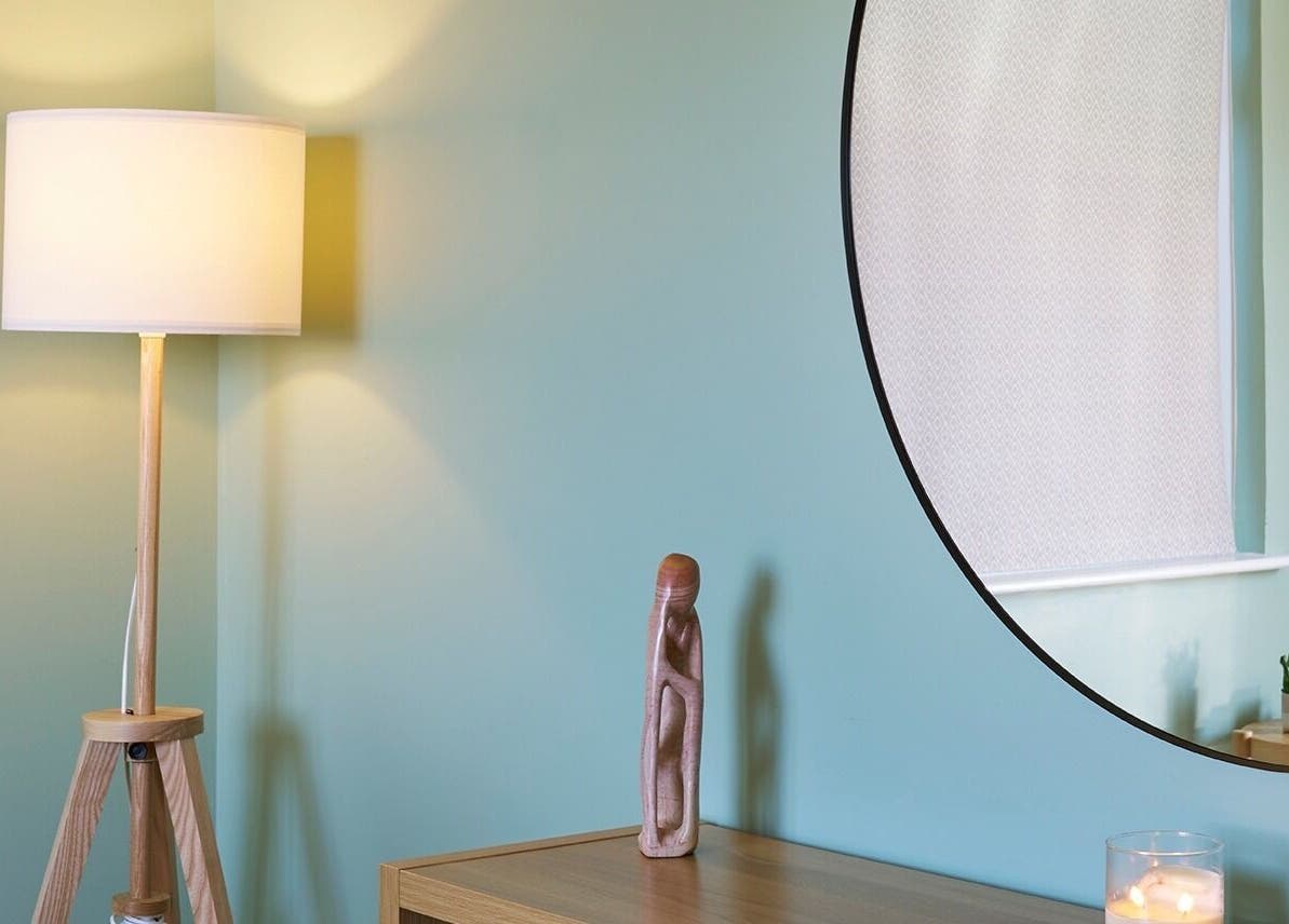 Cozy therapy room at Thrive Therapies, Bideford, England, GB, featuring a lamp and modern decor.