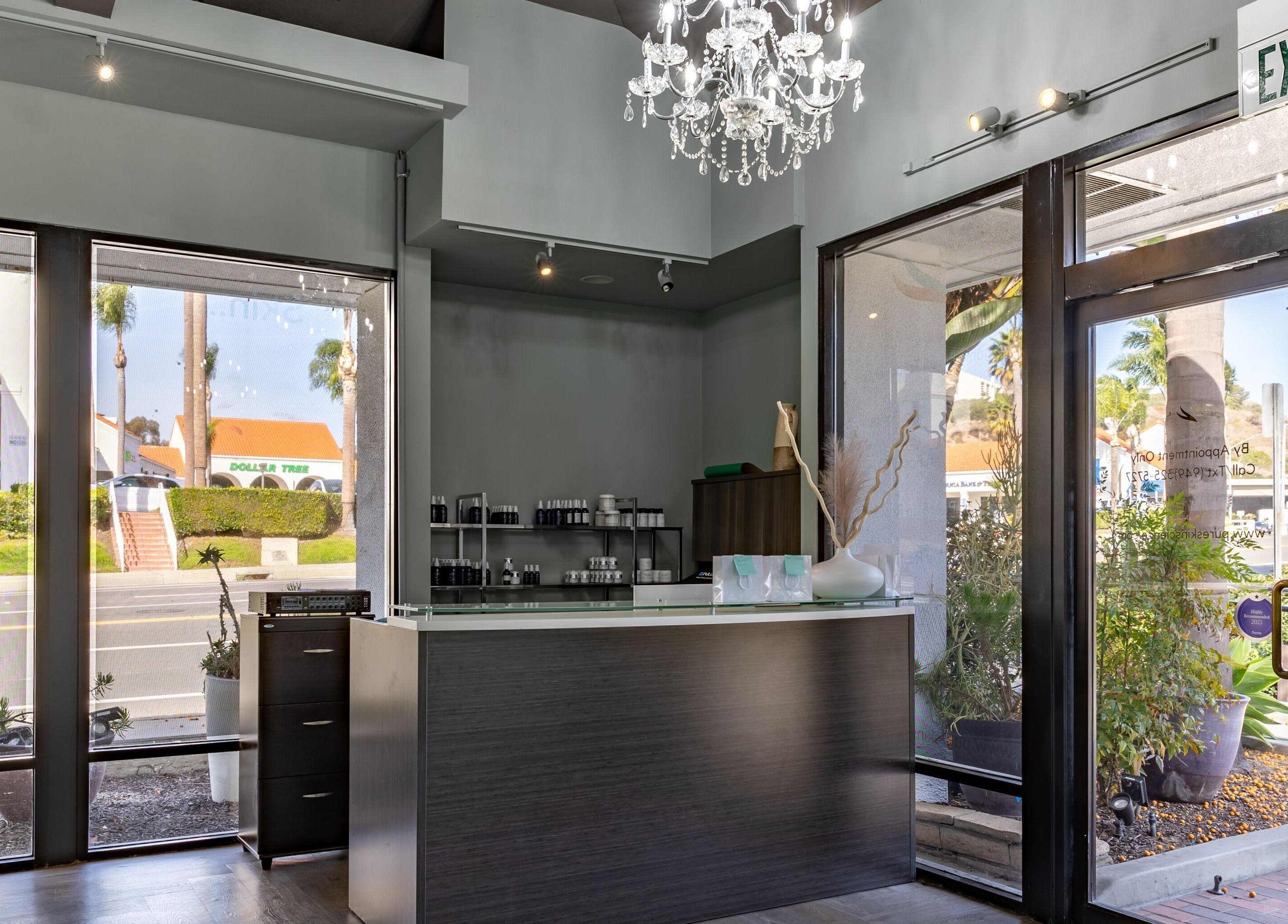 Pure Skin Science Organic Lab and Spa lobby in San Clemente, California, US with elegant decor and chandeliers.