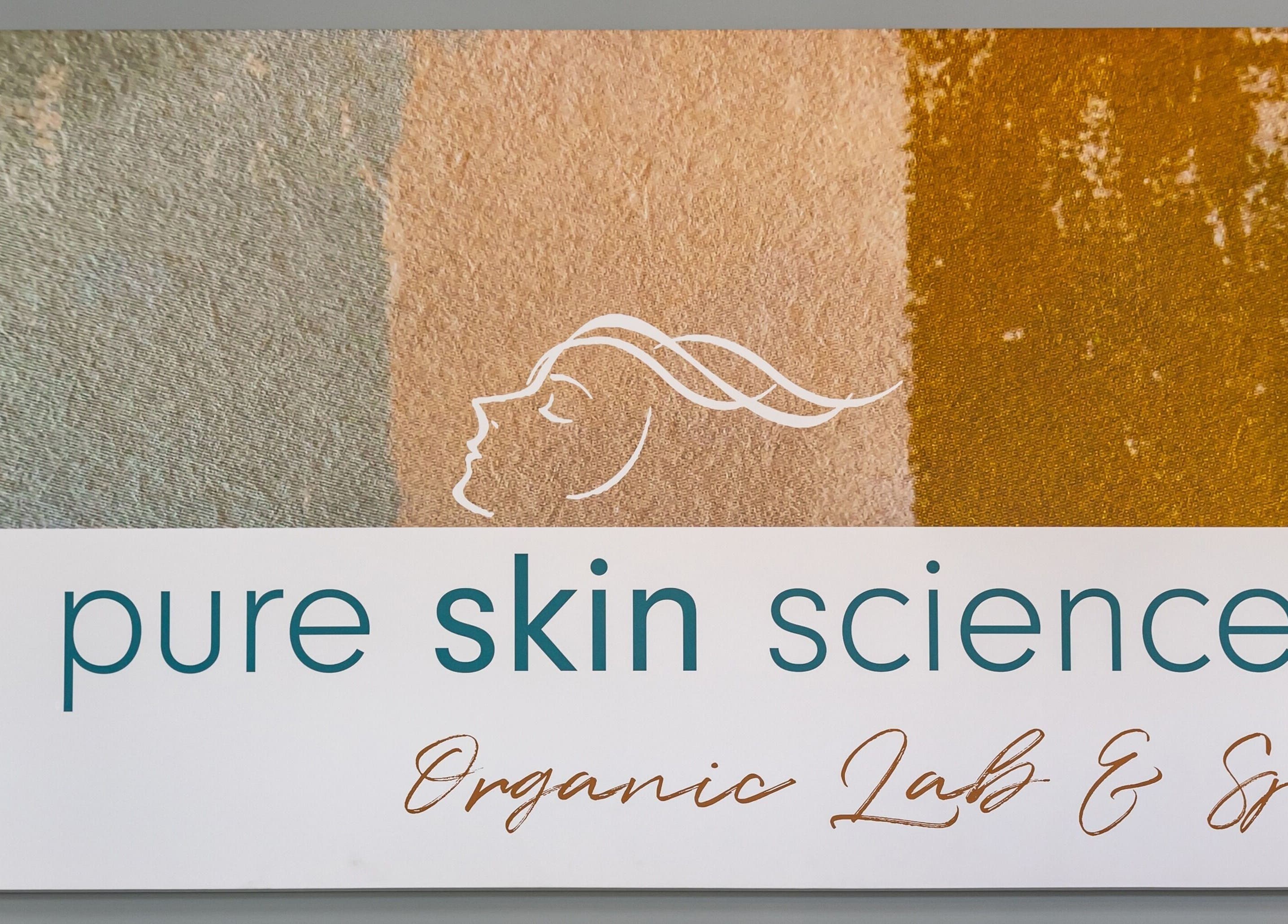 Signage of Pure Skin Science Organic Lab and Spa in San Clemente, California, showcasing serene colors and logo.