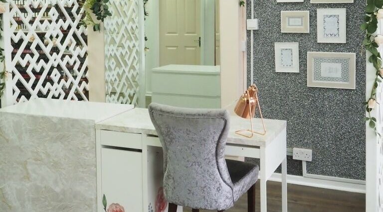 Chic interior design at Deep Hair & Beauty Ltd, Wolverhampton, England, GB with stylish desk and decor.
