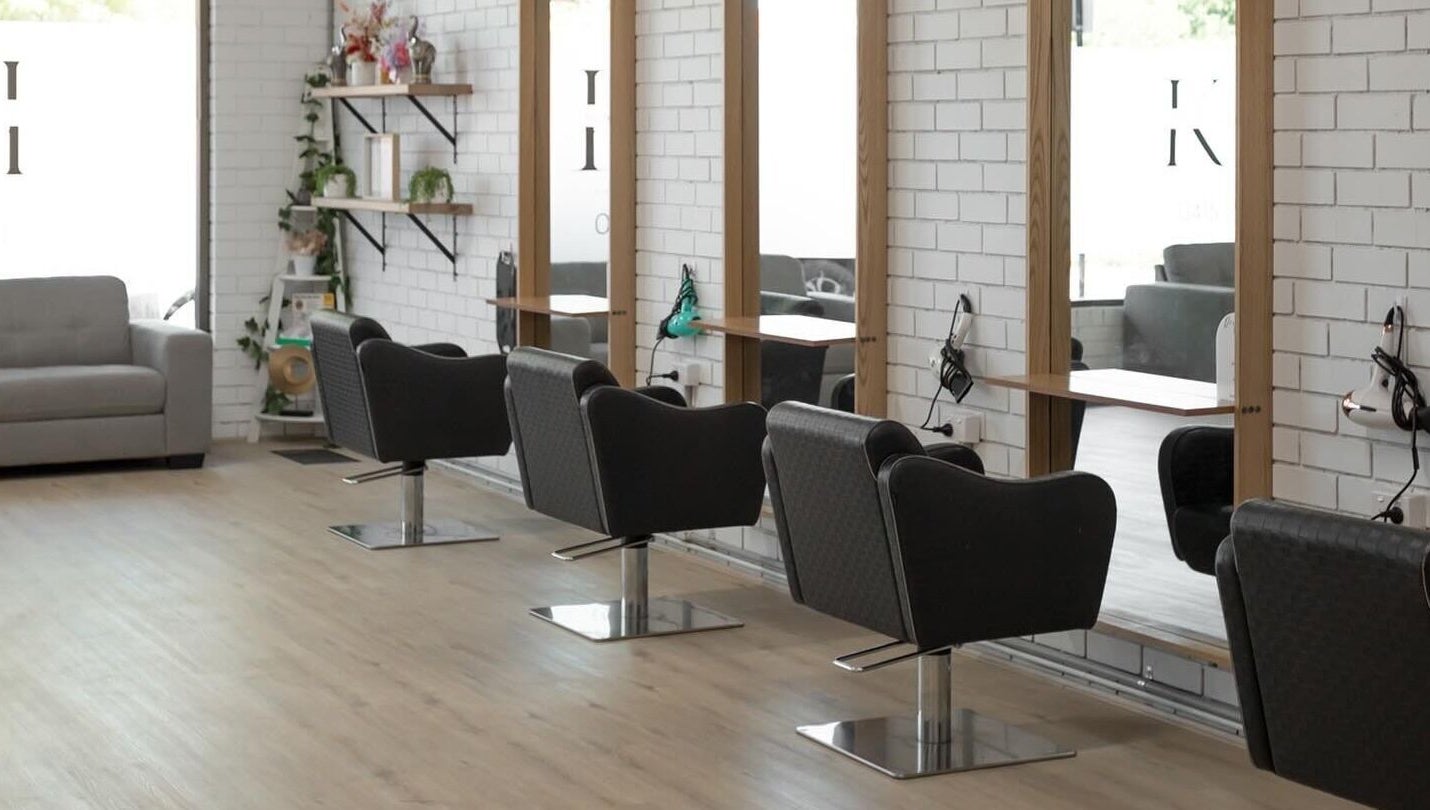 Stylish interior of Spencer the Salon in Alexandra, Victoria, AU with modern chairs and mirrors.