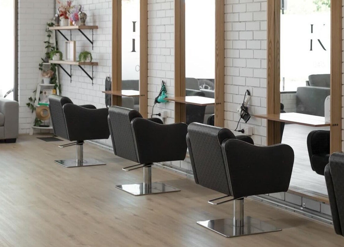 Stylish interior of Spencer the Salon in Alexandra, Victoria, AU with modern chairs and mirrors.
