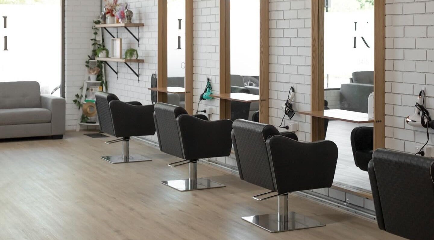 Stylish interior of Spencer the Salon in Alexandra, Victoria, AU with modern chairs and mirrors.